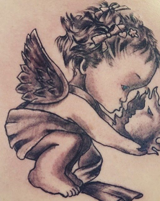Detailed black and grey tattoo work
