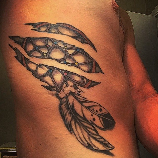 Feather and dreamcatcher tattoo